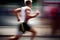 Side view of athletic runner with motion blur on city street