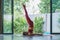 side view of attractive young woman practicing yoga Supported Shoulder Stand pose
