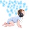 side view of baby boy toddler listening music with headphones over white