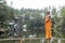 side view of barefoot buddhist meditating