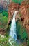 Side view of a beautiful Havasu Falls in Supai with foamy waters on a sunless day