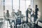 Side view of blurred silhouettes of businessmen talking in conference room