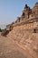 Side View of Borobudur at the base with plenty of small stupas and buddha statues