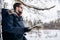 Side-view of Brown-haired Bearded Tourist With Map