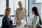 side view of businesswomen listening colleague at meeting