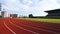 Side view of a Caucasian athletes practicing at a sports stadium, running on racing track, Track and Field Sports Training in Stad