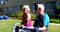 Side view of Caucasian senior couple exercising with dumbbells in the garden of nursing home 4k