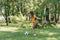 side view of child kicking soccer ball