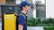 Side view close up smiling food delivery man courier with thermal backpack