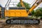 side view of crawler crane, counterweights, big chain and arms