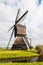Side view Dutch windmill in autumn