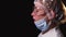 side view face tired woman doctor takes off a protective mask from her face and breathes heavily. The concept of