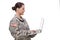 Side view of a female soldier using laptop