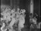 Side view of female tap dancers performing together in nightclub, 1930s