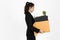 Side view of fired dismissal unemployed young Asian business woman in suit holding box with personal belongings on white isolated