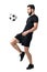 Side view of football or futsal player juggling ball with his knee