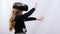 Side view Girls in virtual reality glasses stretching hands for protection
