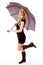 Side view of glamorous model carrying umbrella