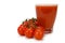 Side view of a glass of tomato juice and a bunch of bush tomatoes