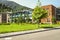 Side view of the glazed academic buildings Of the international school-College in nature reserve city Dilijan located in the fore