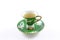 Side view of green and white teacup and saucer with tea