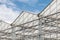 Side view of a greenhouse against a blue sky