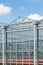 Side view of a greenhouse with flowers inside