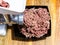 Side view of grinding of minced meat at home