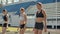 Side view of a group female athlete starting her sprint on a running track. Runner taking off from the starting blocks