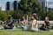 Side view of group of intercultural athletes practicing yoga outdoor