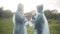 Side view of happy children playing rock-paper-scissors in sunrays on rainy summer day. Positive cheerful Caucasian boy