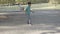 Side view of kids playing hopscotch on asphalt