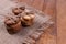 side view and a little top view of the gingerbread cookies, folded in piles and tied with a string, lie on a gray rug with fringed