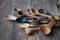Side view lot of wooden spoons made of precious wood on wooden table, eco-friendly concept of cutlery, handmade tableware