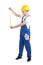 Side view of man builder in blue coveralls holding measure tape