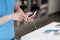 Side view on man looking at cellphone at electronics store