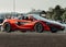 Side view of a mesmerizing red McLaren parked outdoors in Hunt Valley