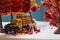 Side view miniature toy figurines of alone courier man holding delivery box  in autumn, fall season or during cherry blossom