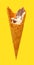 side view of mostly eaten vanilla flaovr ice cream cone on a yellow background