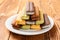 Side view multicolor sandwich cookies on wood table