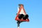 Side view of old rectangle red and white railway crossing warning lights sign mounted on strong metal pole