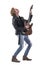 Side view of passionate skilled rock guitarist playing electric guitar bending backward.