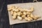 side view peanuts in shell on a bag on a wooden table