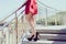 Side view photo portrait of sexual seductive fit slim long legs, red retro shiny colorful chiffon elegant dress. Happy girl