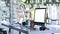 Side view of photographer workstation with modern multiple devices mockup on white table.