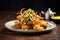 side view of plate piled with mixed veg pakoras