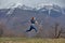 Side View Portrait Of Athlete Redhead Lady Jumping High During Training In Nature, Sportswoman