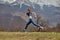 Side View Portrait Of Fit Redhead Lady Jumping High During Training In Nature, Sportswoman