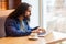 Side view portrait of handsome intelligence young adult man freelancer in casual style sitting in cafe and searching information