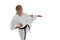 Side view portrait of one caucasian sportsman training isolated over white background. Karate, judo, taekwondo sport